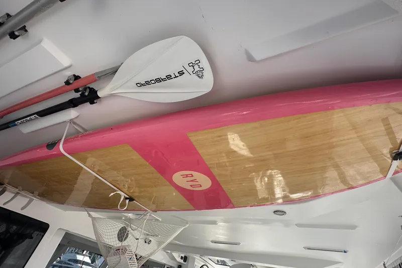 Gtfo Yacht Photos Pics Pink and wood paddleboard with paddle, Balance 482 model, 2023.