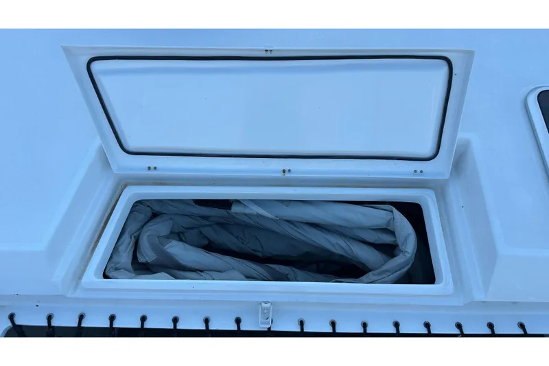 Gtfo Yacht Photos Pics Open storage compartment on Balance 482 boat, 2023 model, with folded fabric inside.