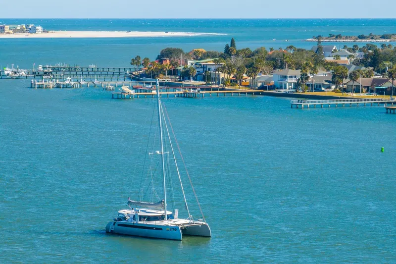 Gtfo Yacht Photos Pics Catamaran Balance 482 sailing near coastal homes, 2024 model.