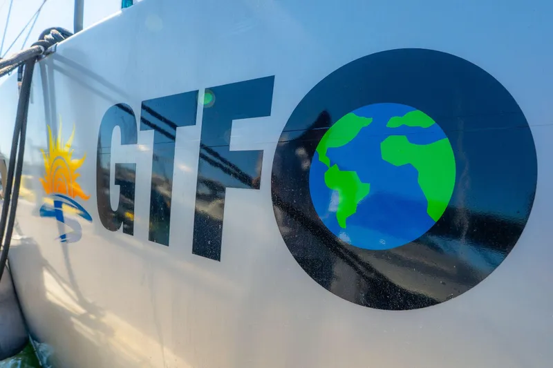 Gtfo Yacht Photos Pics Balance 482 boat with GTFO logo and Earth graphic, 2024 model.