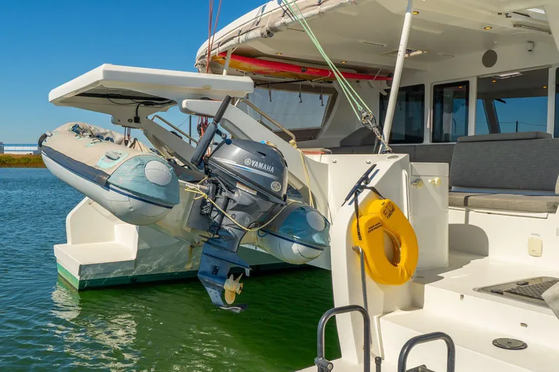 Gtfo Yacht Photos Pics 2024 Balance 482 yacht with Yamaha motor and inflatable boat on water.