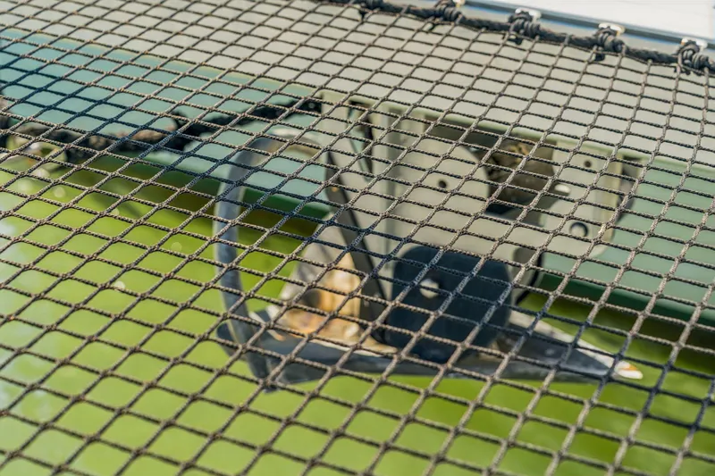 Gtfo Yacht Photos Pics Close-up of Balance 482 boat netting over green water, 2024 model.