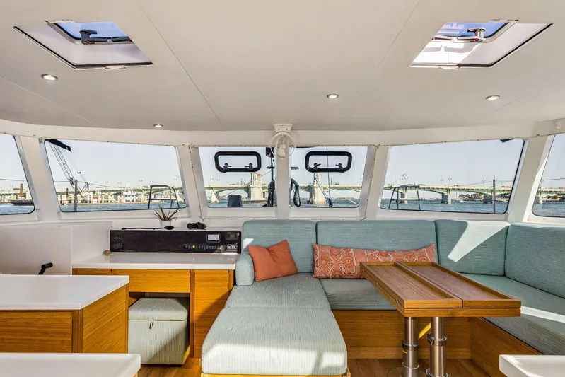 Gtfo Yacht Photos Pics 2024 Balance 482 yacht interior with panoramic windows, modern seating, and wooden accents.
