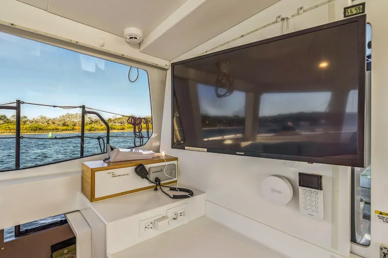 Gtfo Yacht Photos Pics Interior of 2024 Balance 482 yacht with TV, navigation equipment, and scenic water view.