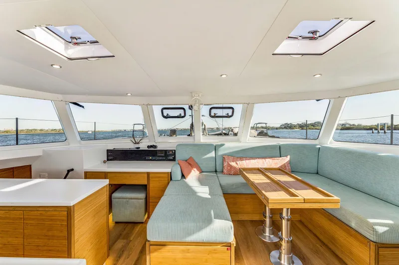 Gtfo Yacht Photos Pics Luxurious interior of 2024 Balance 482 catamaran with panoramic windows and modern seating.