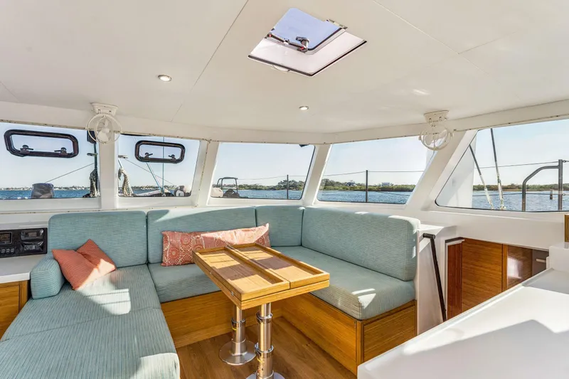 Gtfo Yacht Photos Pics Interior of 2024 Balance 482 yacht with cozy seating and panoramic windows.