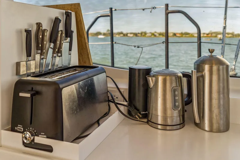 Gtfo Yacht Photos Pics Kitchen appliances and knives on a Balance 482 yacht, 2024 model, with ocean view.