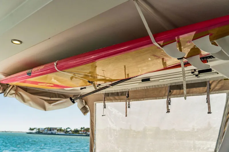 Gtfo Yacht Photos Pics Surfboard stored on a 2024 Balance 482 yacht, overlooking a scenic waterfront.