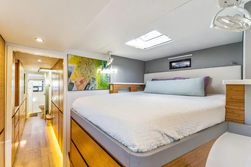 Gtfo Yacht Photos Pics Modern bedroom interior in 2024 Balance 482 yacht, featuring cozy bed and stylish decor.