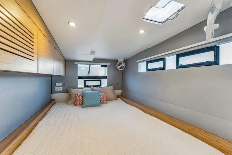 Gtfo Yacht Photos Pics Luxurious cabin interior of 2024 Balance 482 yacht with modern bedding and natural light.