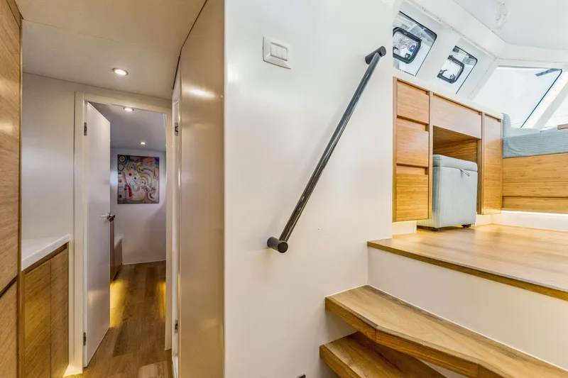 Gtfo Yacht Photos Pics Modern interior of 2024 Balance 482 yacht with wooden stairs and sleek design.