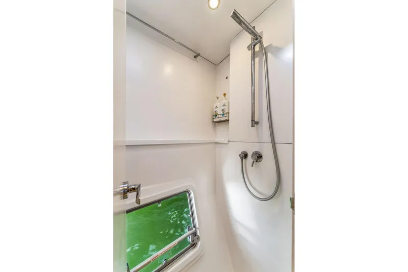 Gtfo Yacht Photos Pics Modern shower in 2024 Balance 482 model, featuring sleek design and window view.
