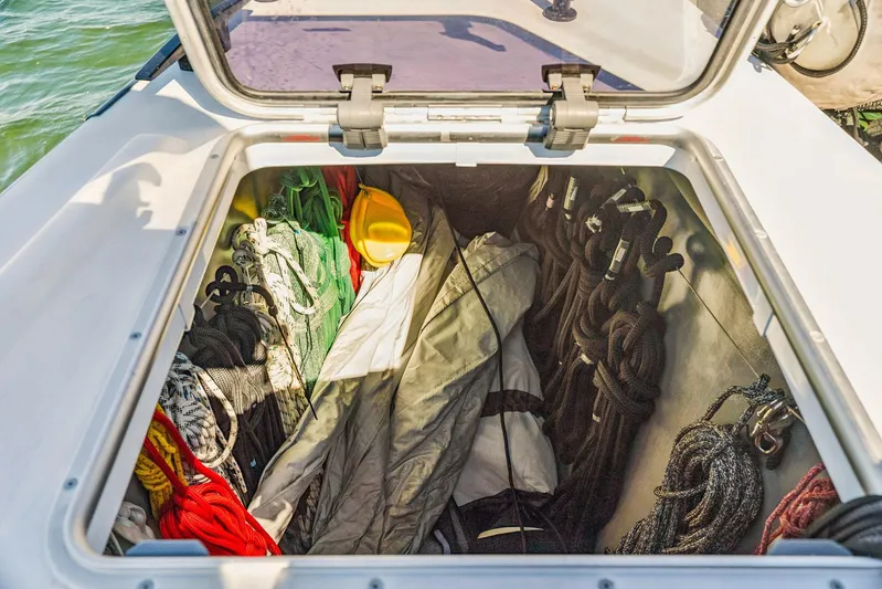 Gtfo Yacht Photos Pics Open storage compartment on Balance 482 boat, containing ropes, tarp, and safety gear.