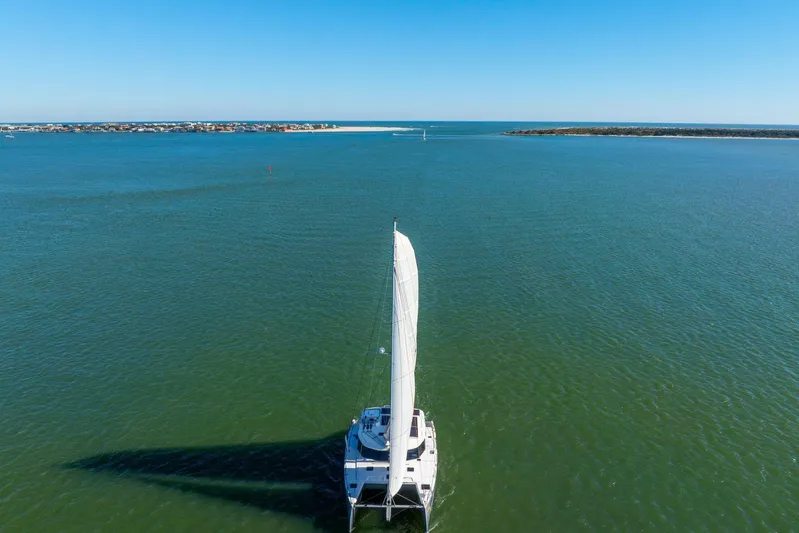 Gtfo Yacht Photos Pics Sailing catamaran Balance 482, 2024 model, cruising on open sea under clear blue sky.