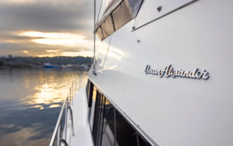 Ungrounded Yacht Photos Pics Ocean Alexander 440 Sundeck CPMY yacht, 1991 model, on water at sunset.