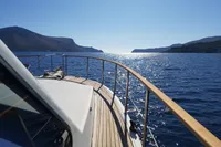 Bow view of 2001 Trader 535 Signature yacht cruising on a sunny day.