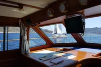 Interior view of 2001 Trader 535 Signature yacht with ocean and sailboat outside.