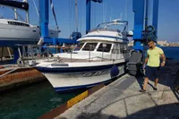 2001 Trader 535 Signature yacht docked at marina with man walking nearby.