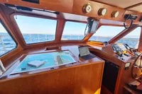 Pilothouse of 2001 Trader 535 Signature yacht with navigation tools and ocean view.