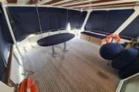Spacious deck of 2001 Trader 535 Signature yacht with seating and life rings.