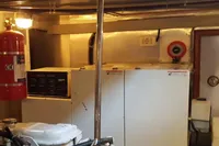 Engine room of 2001 Trader 535 Signature yacht with equipment and safety gear.