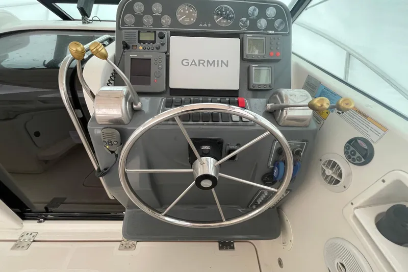  Yacht Photos Pics 2003 Tiara Yachts 3100 Open helm with Garmin navigation and control panel.
