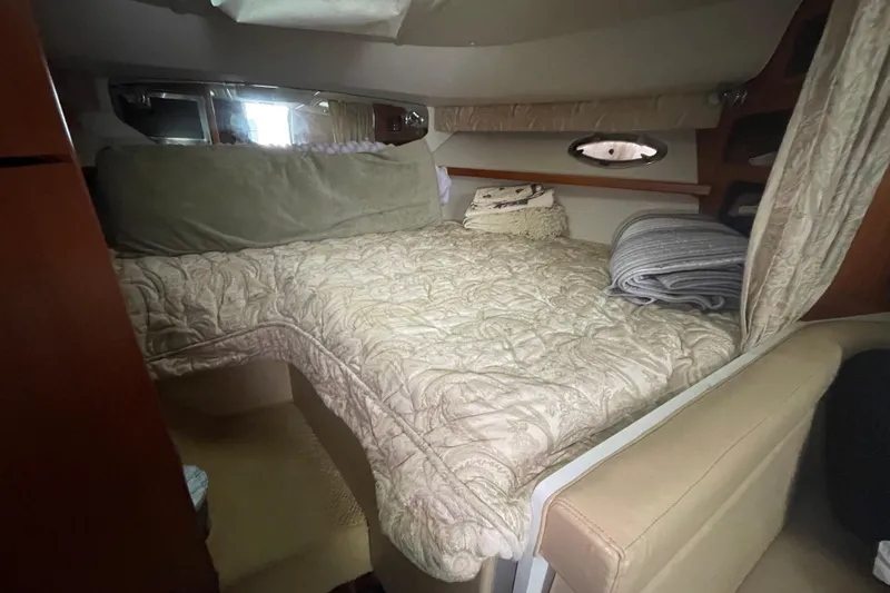  Yacht Photos Pics 2003 Tiara Yachts 3100 Open cabin with cozy bed and elegant decor.