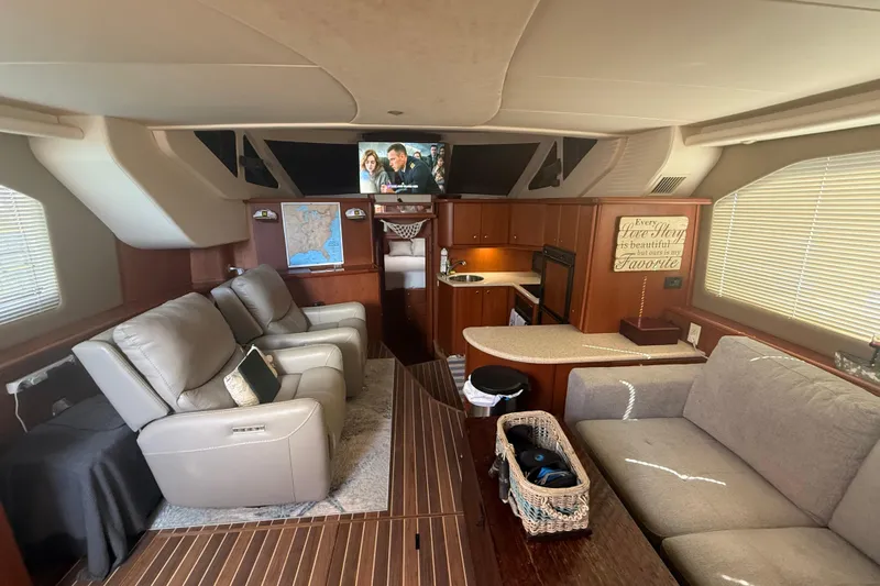  Yacht Photos Pics Luxurious interior of 2005 Silverton 43 Motor Yacht with comfortable seating and modern amenities.