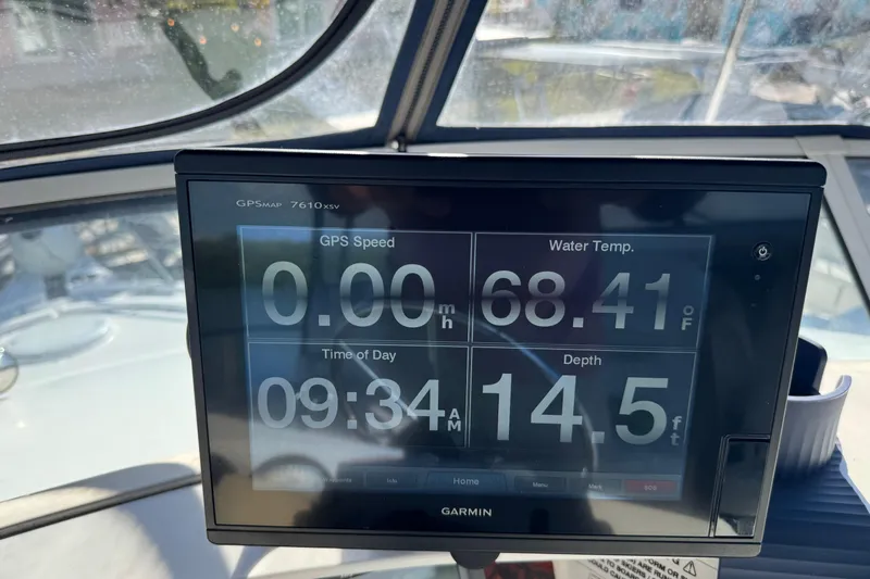  Yacht Photos Pics Garmin GPS display on 2005 Silverton 43 Motor Yacht showing speed, water temperature, and depth.