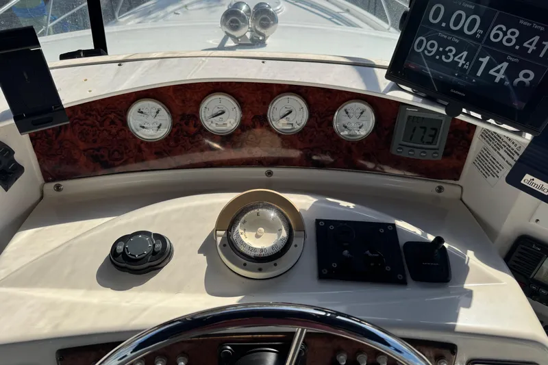  Yacht Photos Pics 2005 Silverton 43 Motor Yacht dashboard with gauges, compass, and navigation display.