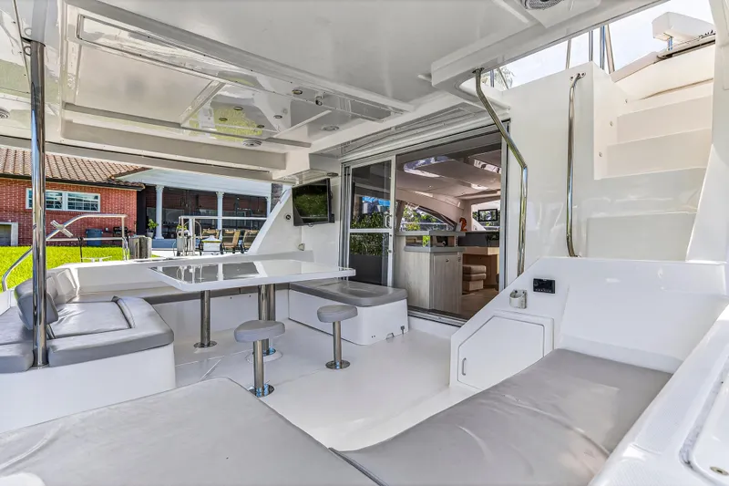 Southern Sky Yacht Photos Pics Luxurious 2018 Leopard 51 Powercat yacht interior with seating, table, and modern design.