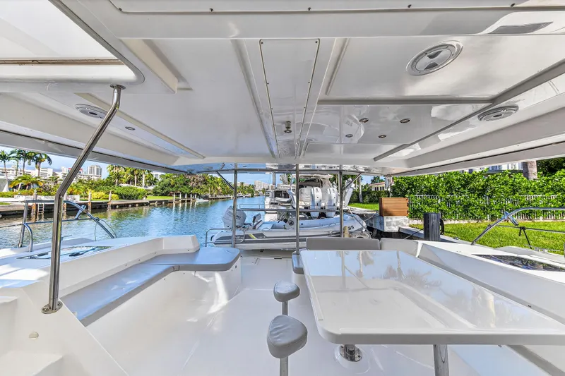 Southern Sky Yacht Photos Pics 2018 Leopard 51 Powercat yacht interior with spacious seating and scenic waterway view.