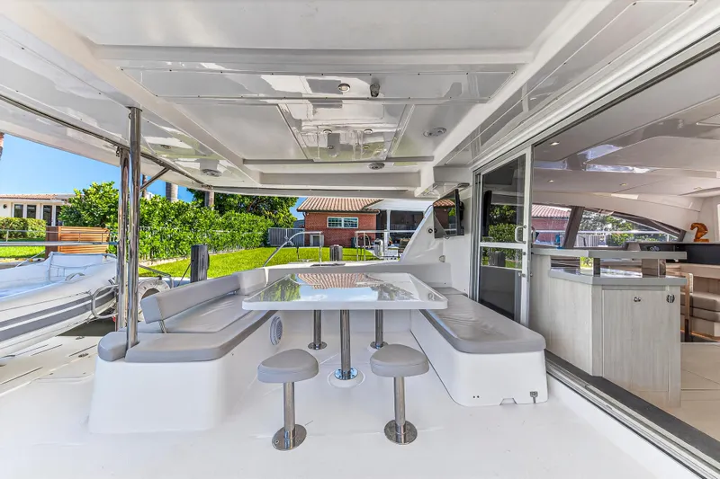 Southern Sky Yacht Photos Pics 2018 Leopard 51 Powercat yacht with outdoor seating and dining area.