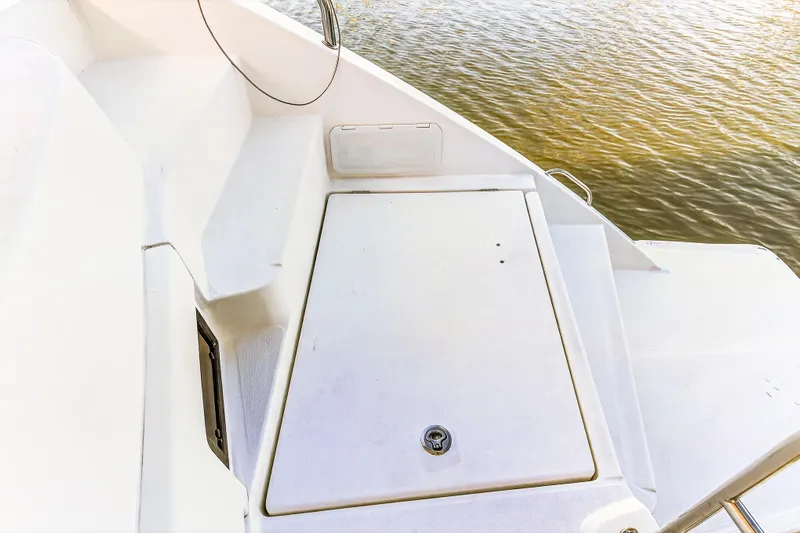 Southern Sky Yacht Photos Pics 2018 Leopard 51 Powercat deck view with storage compartment, near water.