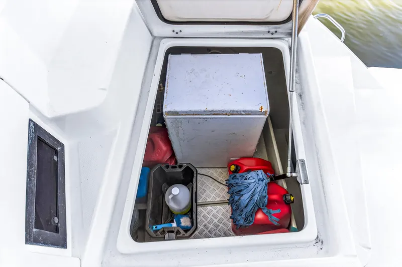 Southern Sky Yacht Photos Pics Storage compartment on 2018 Leopard 51 Powercat with cleaning supplies and fuel containers.