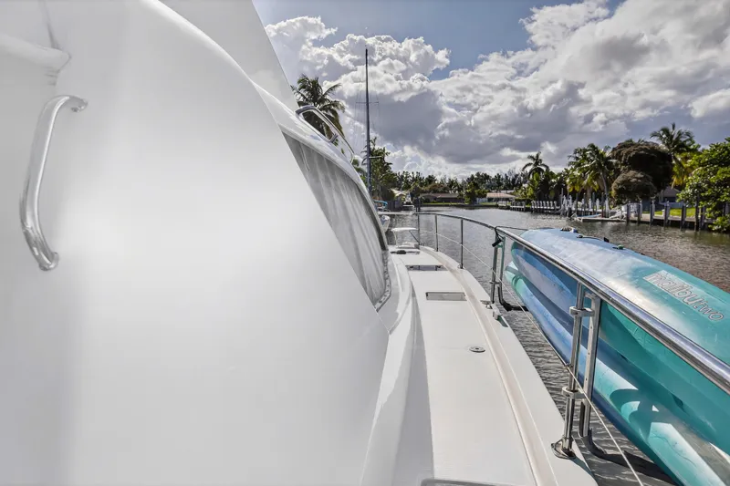 Southern Sky Yacht Photos Pics 2018 Leopard 51 Powercat yacht docked by a scenic canal with palm trees.