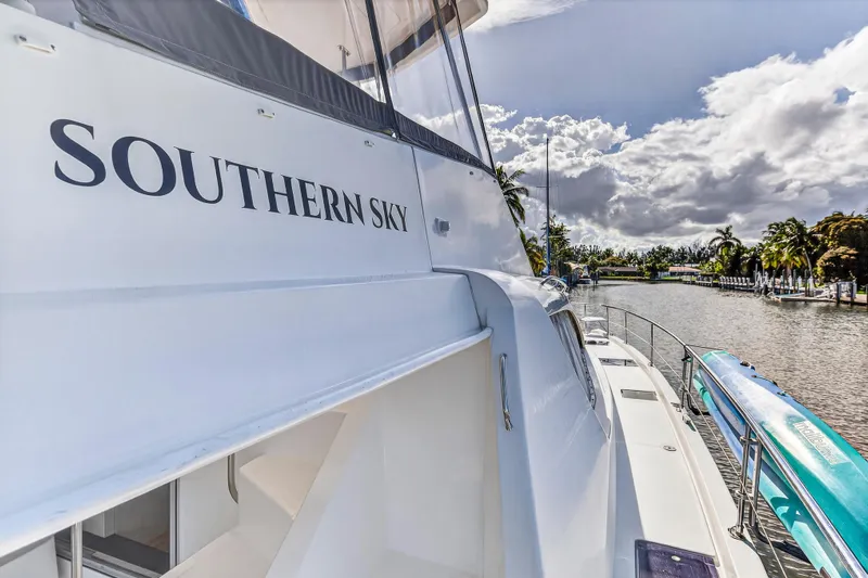Southern Sky Yacht Photos Pics 2018 Leopard 51 Powercat "Southern Sky" docked by a scenic waterway.