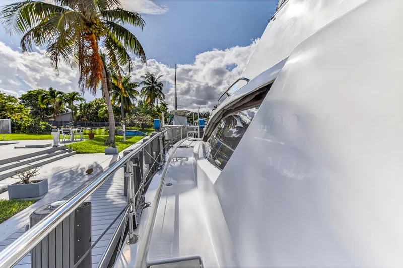 Southern Sky Yacht Photos Pics 2018 Leopard 51 Powercat yacht docked near tropical palm trees under a bright sky.