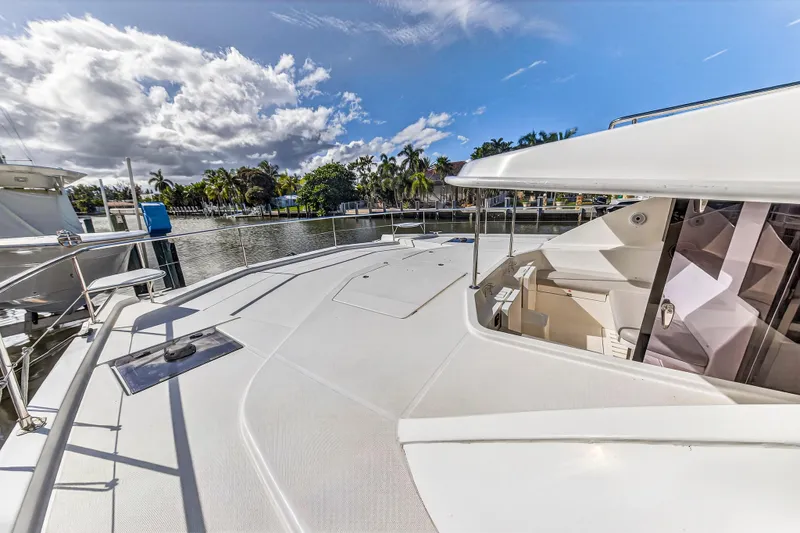 Southern Sky Yacht Photos Pics 2018 Leopard 51 Powercat yacht deck with clear skies and waterfront view.