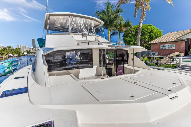 Southern Sky Yacht Photos Pics 2018 Leopard 51 Powercat yacht docked, featuring spacious deck and modern design.