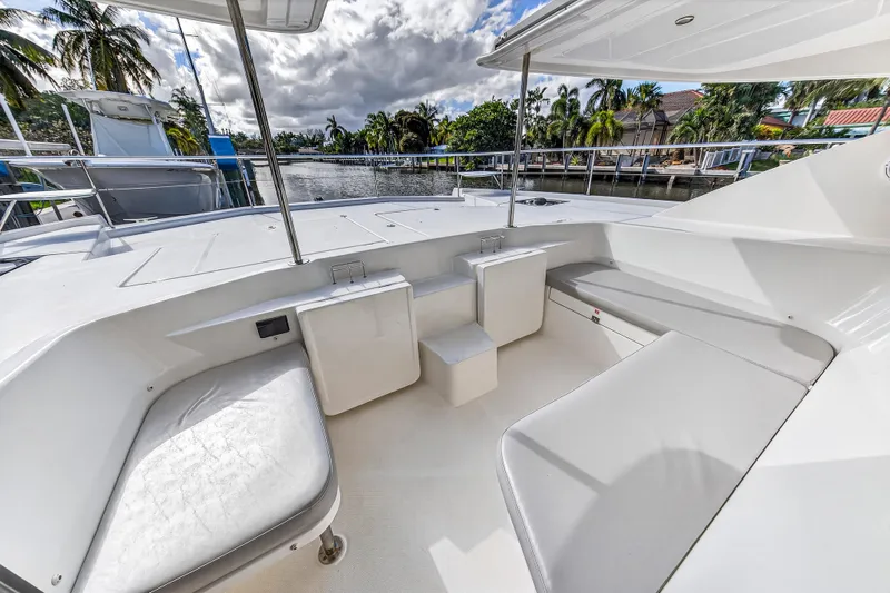 Southern Sky Yacht Photos Pics 2018 Leopard 51 Powercat deck with seating, surrounded by tropical scenery and waterway.
