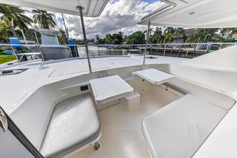 Southern Sky Yacht Photos Pics Spacious deck area of 2018 Leopard 51 Powercat with seating and tables, surrounded by waterway.