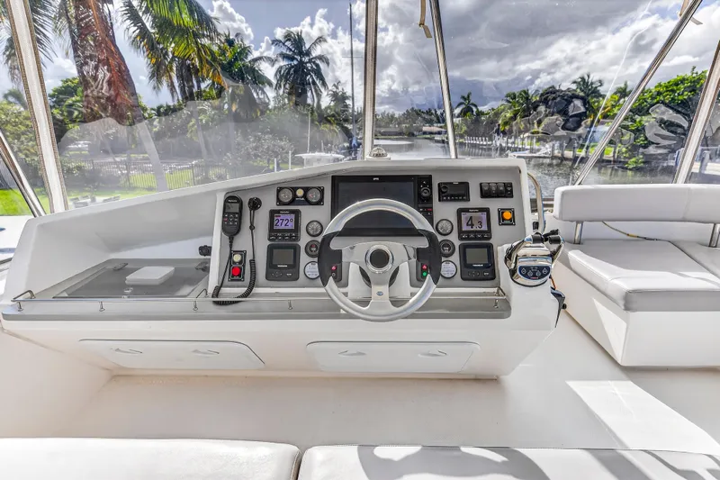 Southern Sky Yacht Photos Pics Helm of 2018 Leopard 51 Powercat with modern controls and tropical backdrop.