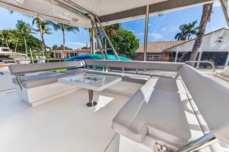 Southern Sky Yacht Photos Pics Luxurious seating area on 2018 Leopard 51 Powercat yacht with tropical backdrop.