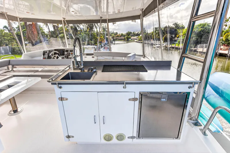 Southern Sky Yacht Photos Pics 2018 Leopard 51 Powercat yacht interior with modern kitchen and scenic waterway view.