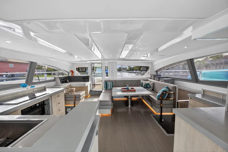 Southern Sky Yacht Photos Pics Luxurious interior of 2018 Leopard 51 Powercat yacht with modern kitchen and seating area.