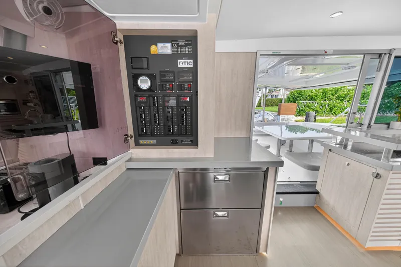 Southern Sky Yacht Photos Pics Interior of 2018 Leopard 51 Powercat yacht with control panel and modern kitchen area.