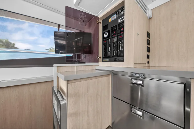 Southern Sky Yacht Photos Pics Modern kitchen area in 2018 Leopard 51 Powercat with stainless steel appliances and control panel.