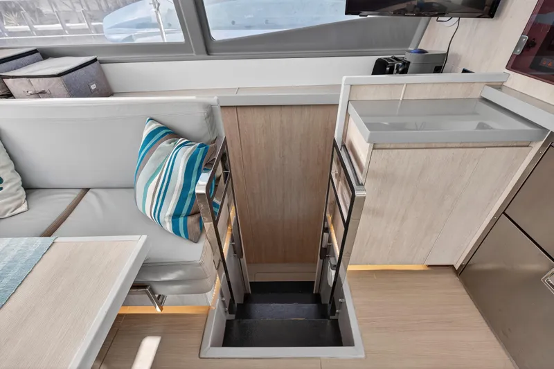 Southern Sky Yacht Photos Pics Interior of 2018 Leopard 51 Powercat with modern seating and striped pillow.