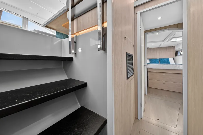Southern Sky Yacht Photos Pics Interior of 2018 Leopard 51 Powercat showing stairs and bedroom entrance.